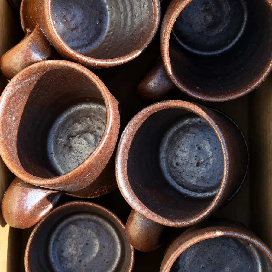 A stack of handmade ceramic cups at Special mention cafe