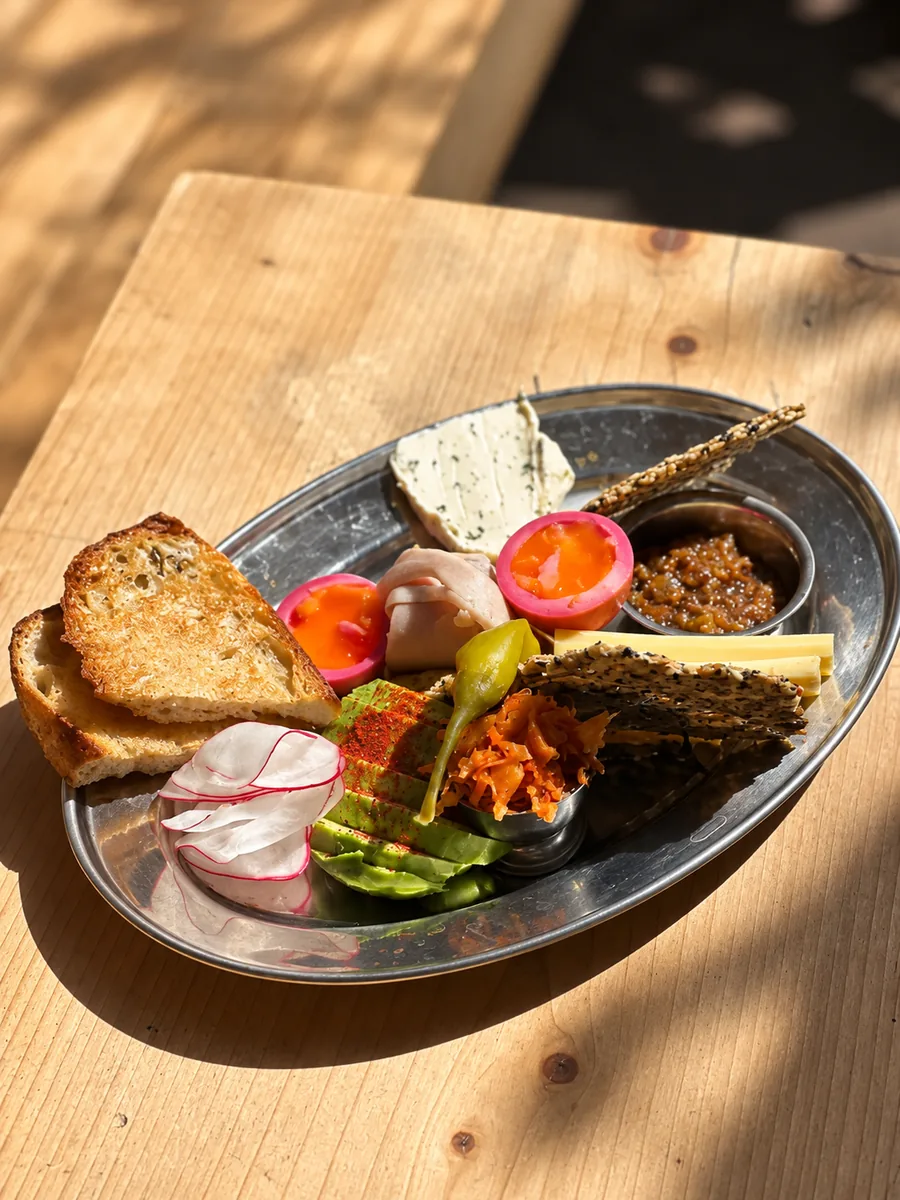 A breakfast platter with toast, vegetables and seasonal sides at Special mention cafe